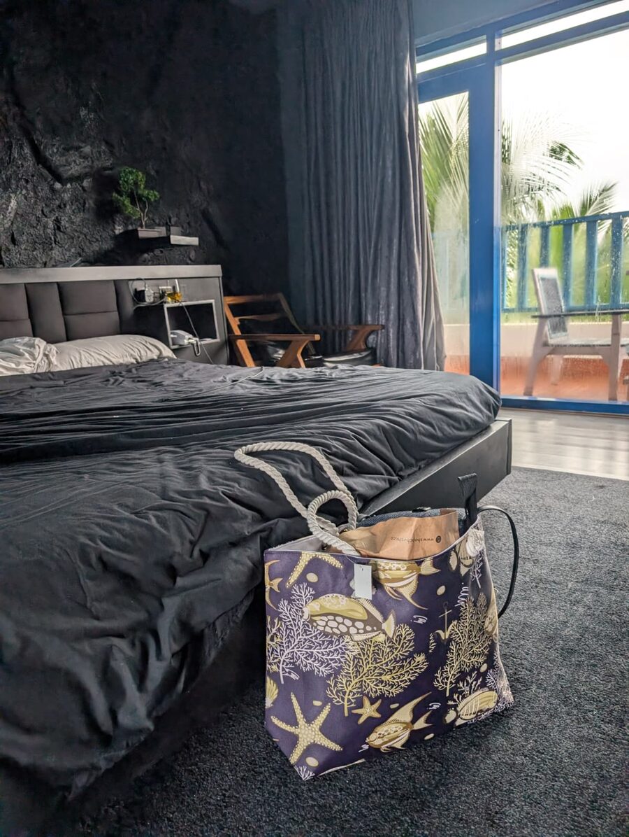 Curated guest welcome gift bag styled in a hotel room