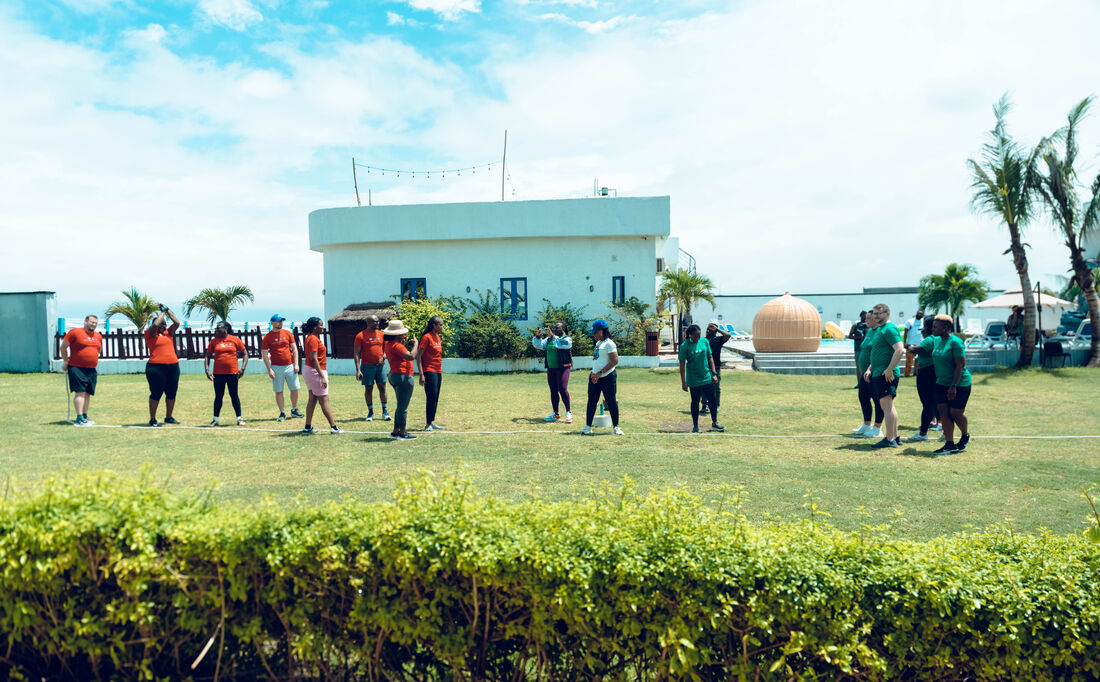 Guests enjoying outdoor group games at a coordinated resort event